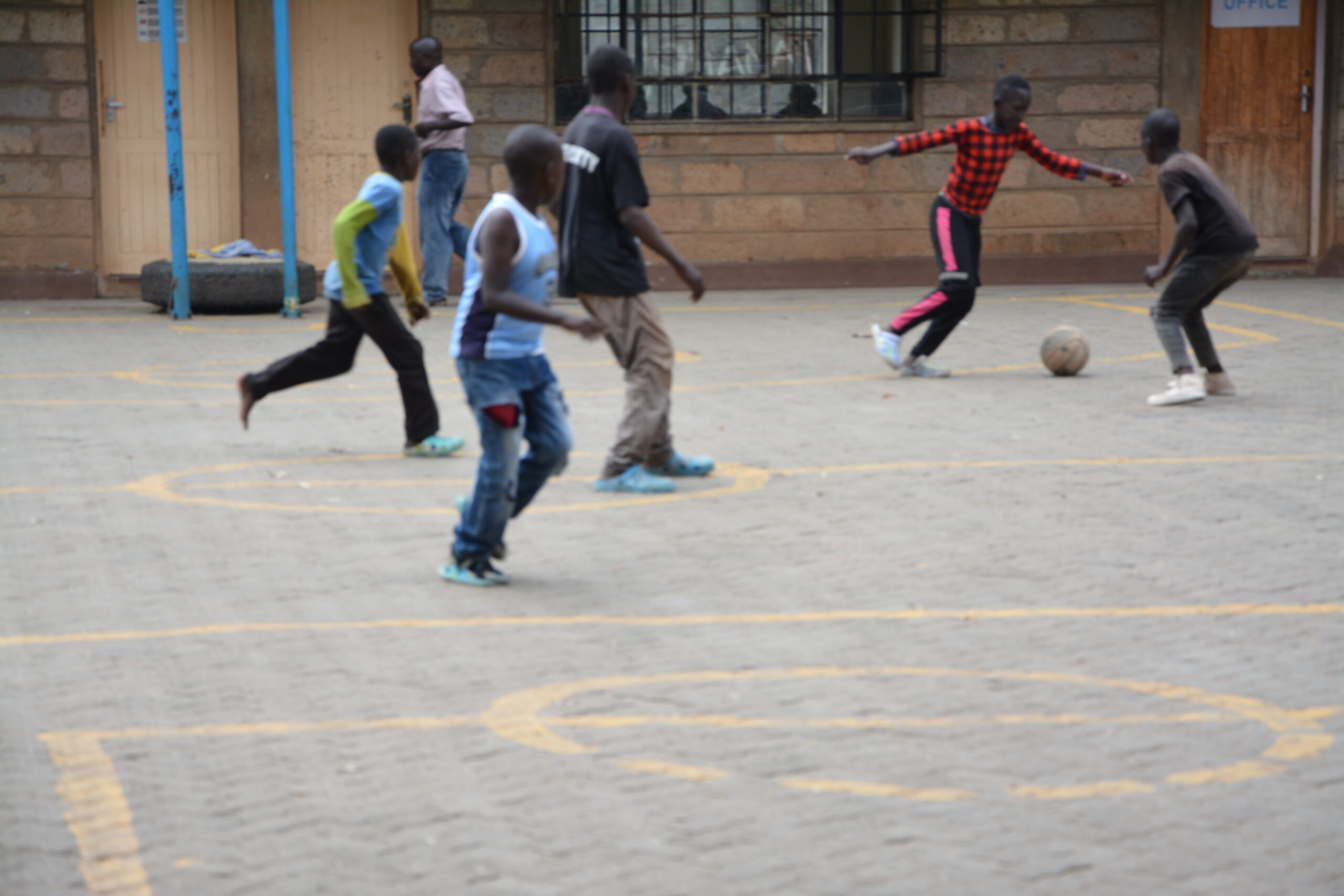 Boys playing outside Mtaani Radio